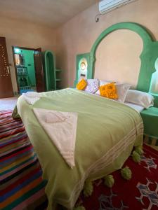 Postel nebo postele na pokoji v ubytování Maison Hassan Merzouga