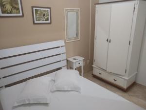 Кровать или кровати в номере Pousada Ondas da Barra