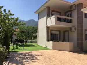 a house with a patio with a table and chairs at DeniaStella villas in Skala Potamias