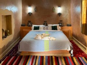 Postel nebo postele na pokoji v ubytování Maison Hassan Merzouga