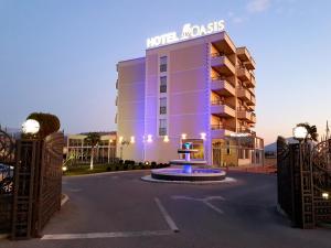 a hotel building with a sign that reads hoteloss at Hotel Oasis in Podgorica