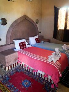 Postel nebo postele na pokoji v ubytování Maison Hassan Merzouga