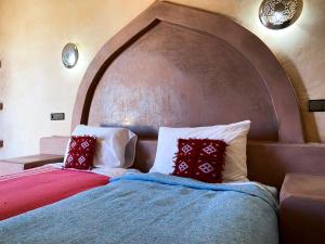 Postel nebo postele na pokoji v ubytování Maison Hassan Merzouga