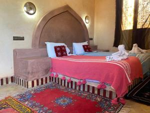 Postel nebo postele na pokoji v ubytování Maison Hassan Merzouga