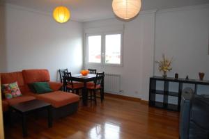 a living room with a couch and a table at La Casa de Lines in Monforte de Lemos +11 photos