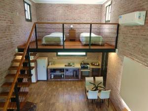 a loft bedroom with a bunk bed and a staircase at Las Arecas in Carmen de Areco +72 photos