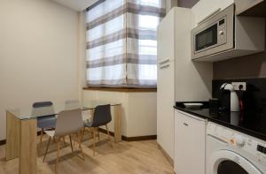 Η κουζίνα ή μικρή κουζίνα στο DE LA GUARDIA SUITE 2 +17 φωτογραφίες