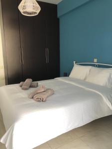 Ένα ή περισσότερα κρεβάτια σε δωμάτιο στο DiFan Sea Homes A1