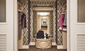 a walk in closet with a round table and a mirror at Four Seasons Hotel Las Vegas in Las Vegas