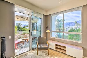 a living room with a chair and a window at Chic Palm Springs Retreat with View Near Escena Golf in Palm Springs