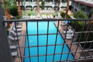 an overhead view of a swimming pool from a balcony at Shalimar Hotel of Las Vegas in Las Vegas