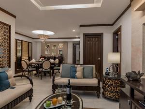 a living room with chairs and a dining room at Henann Regency Resort and Spa in Boracay