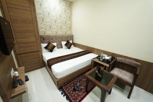 Postel nebo postele na pokoji v ubytování hotel s.s royal