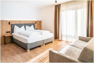 Postel nebo postele na pokoji v ubytování Garni B&B Chi Vai