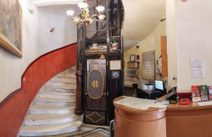 a staircase leading up to a room with a stair case at Cecil Hotel in Athens