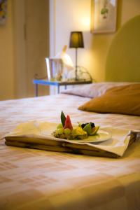 A bed or beds in a room at Hotel Marconi