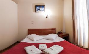 Postel nebo postele na pokoji v ubytování Cecil Hotel