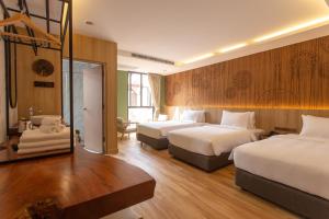 Ліжко або ліжка в номері Nine Hotel Chiangmai