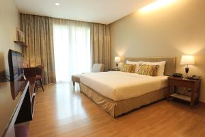 Llit o llits en una habitació de Le Patta Hotel Chiang Rai SHA Extra Plus
