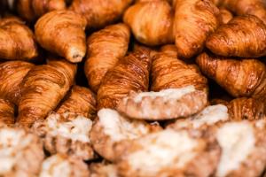 a pile of croissants and other pastries on display at Northern Lights Village Levi in Levi