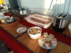 a counter with two plates of food on a table at Chareena Garden in Ko Lipe