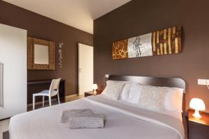 Un pat sau paturi într-o cameră la Il Giardino Di Lory