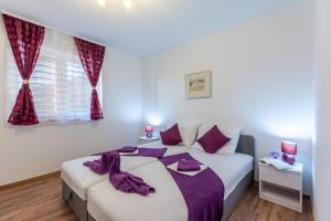 Postel nebo postele na pokoji v ubytování Apartments Palma