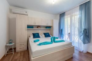 Postel nebo postele na pokoji v ubytování Apartments Palma