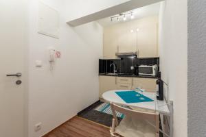 Kuchyň nebo kuchyňský kout v ubytování Apartments Palma