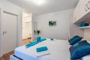 Postel nebo postele na pokoji v ubytování Apartments Palma