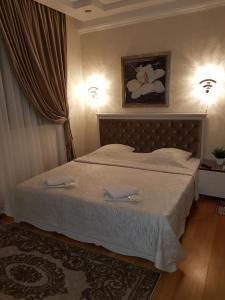 Łóżko lub łóżka w pokoju w obiekcie Small accommodation facility Guest house Zolotaya Milya