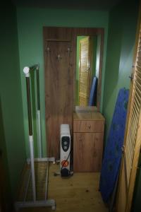 a room with a mop and a mirror at Apartments Provence in Chernivtsi