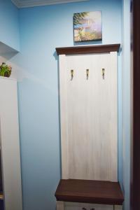 a wooden door in the corner of a room at Apartments Provence in Chernivtsi