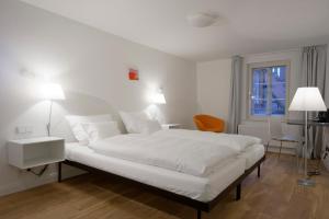 Postel nebo postele na pokoji v ubytování einzigartig - Das kleine Hotel im Wasserviertel