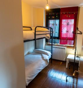 Postel nebo postele na pokoji v ubytování Albergue de Prioro