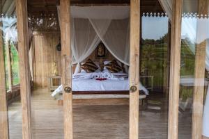 Postel nebo postele na pokoji v ubytování Kidem Ubud Villas