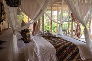 Postel nebo postele na pokoji v ubytování Kidem Ubud Villas