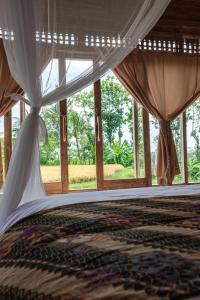 Postel nebo postele na pokoji v ubytování Kidem Ubud Villas