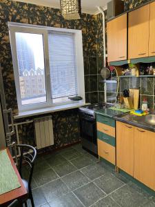Кухня або міні-кухня у Kyiv Relax Flat