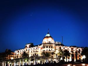 a building with a dome on top at night at Nizza - Boutique Wohnung - near Hotel Negresco in Nice