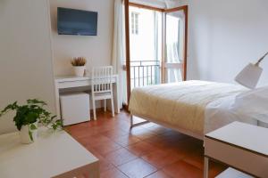 Postel nebo postele na pokoji v ubytování Gialel Pisa Guest House