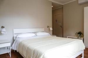 Postel nebo postele na pokoji v ubytování Gialel Pisa Guest House