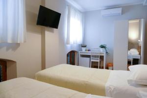 Postel nebo postele na pokoji v ubytování Gialel Pisa Guest House