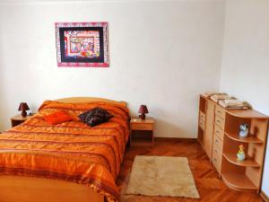 a bedroom with a bed with a cat laying on it at V2 with Love - Vintage Modern and Spacious in Belgrade