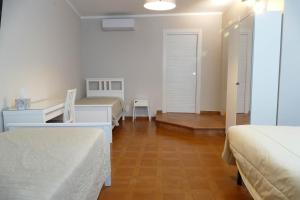 Postel nebo postele na pokoji v ubytování Gialel Pisa Guest House