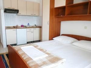 Postel nebo postele na pokoji v ubytování Apartments Šarić