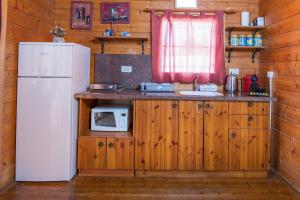 Kuchyň nebo kuchyňský kout v ubytování Nof Kinneret Cabins
