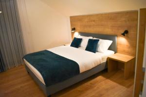 A bed or beds in a room at Apartmány Runi