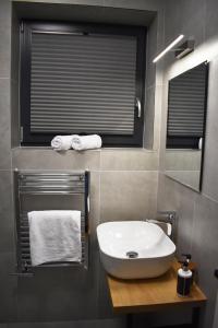 Koupelna v ubytování Apartmány Runi + 35 fotografií