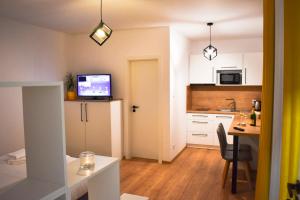 A kitchen or kitchenette at Apartmány Runi